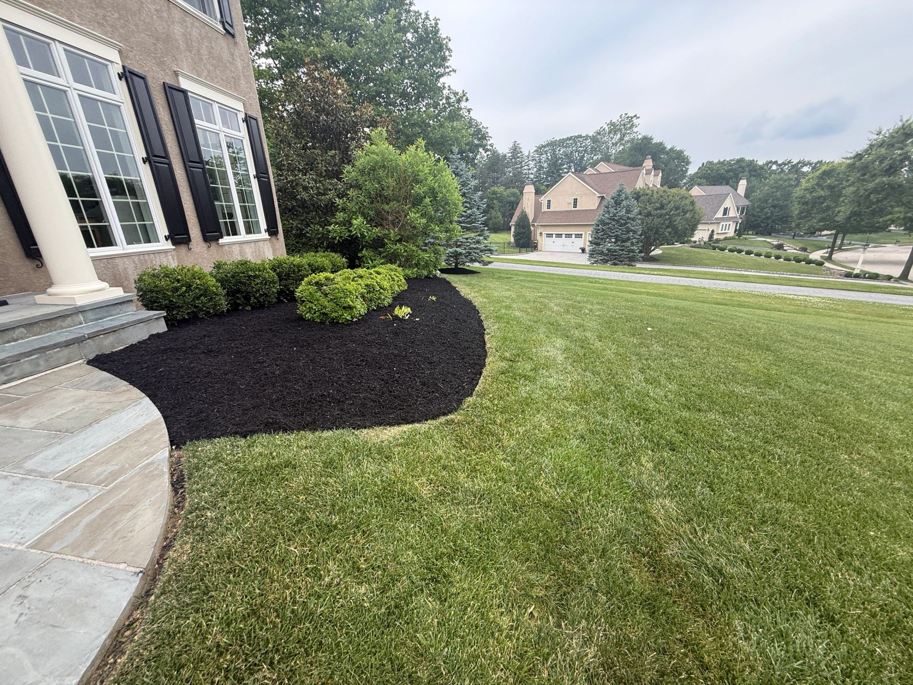 Fresh black mulch bed with clean edges in Chester County, PA